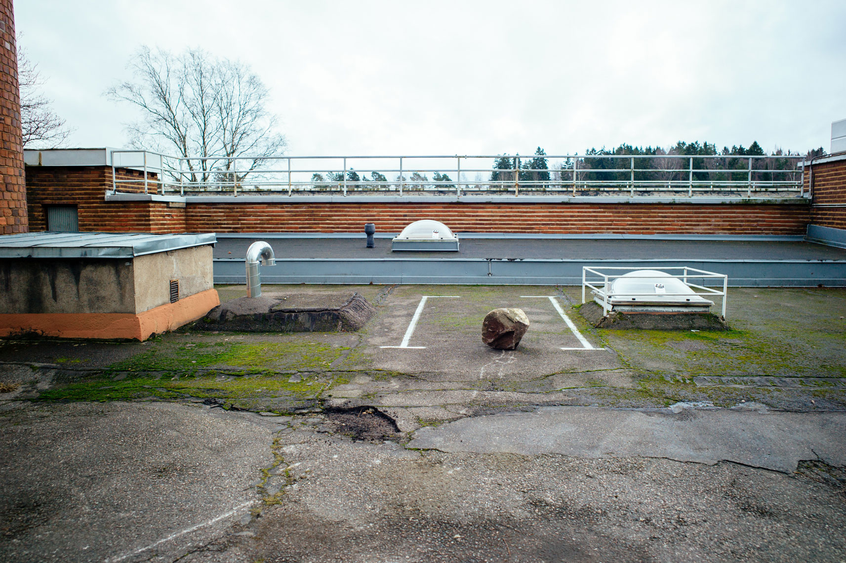 jon pack, photographer | the olympic city | helsinki, finland | parking spot | rock | village